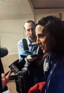 Photo of Attorney Weber talking to the press outside of a courtroom in Boston, MA